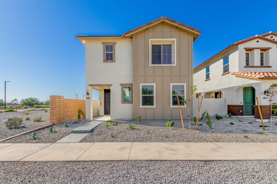 Front exterior of a new home in Solvida at Estrella, Goodyear, AZ, highlighting curb appeal (Image 1).
