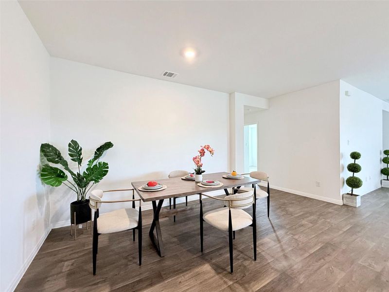 Dining space featuring wood finished floors and baseboards Dining space featuring wood finished floors and baseboards