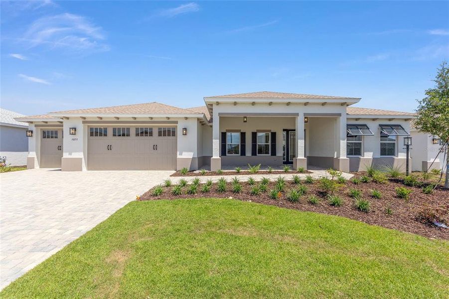 Front exterior of a new home in , Ocala, FL, highlighting curb appeal (Image 2). Front exterior of a new home in , Ocala, FL, highlighting curb appeal (Image 2).