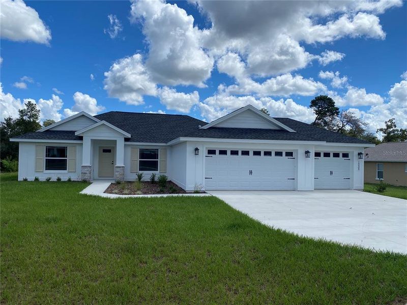 Front exterior of a new home in , Ocala, FL, highlighting curb appeal (Image 25).