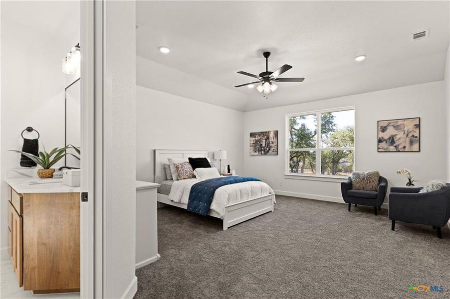 Bedroom featuring dark colored carpet, ceiling fan, and recessed lighting