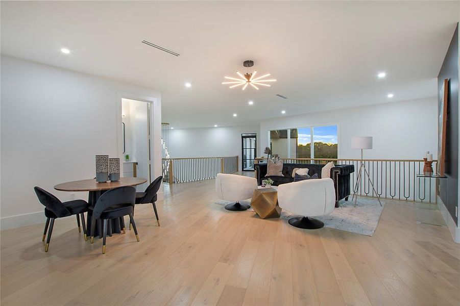 Living room with light hardwood / wood-style flooring