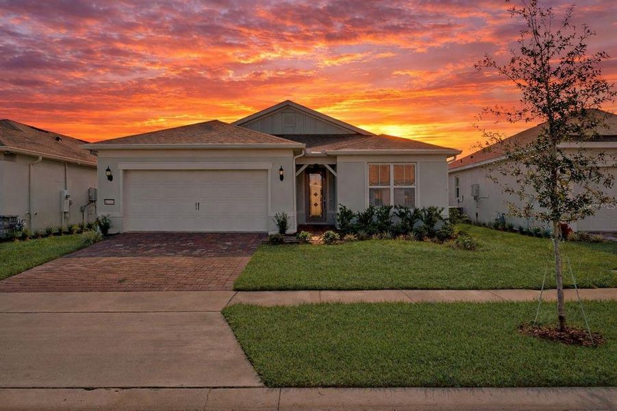 Front exterior of a new home in Del Webb Sunbridge, St. Cloud, FL, highlighting curb appeal (Image 24).