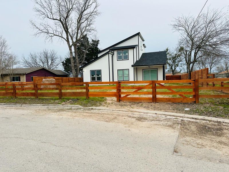 View of front of house featuring a fenced front yard and stucco siding View of front of house featuring a fenced front yard and stucco siding