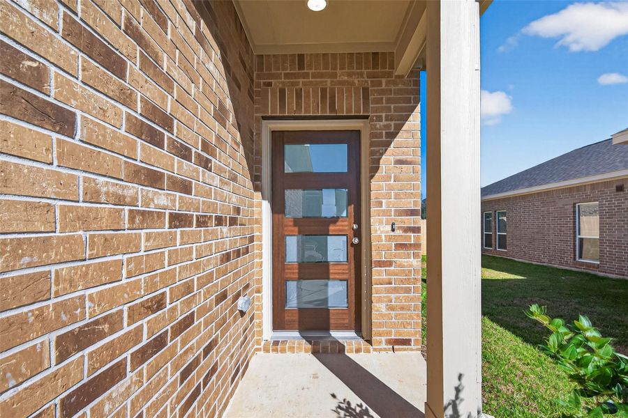 Exterior details and patio area of a home in Enclave at Willis, Willis (Image 27).