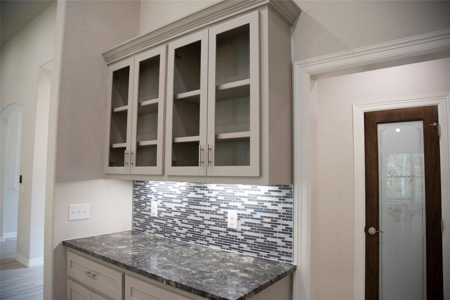 Sample pantry with glass door.
