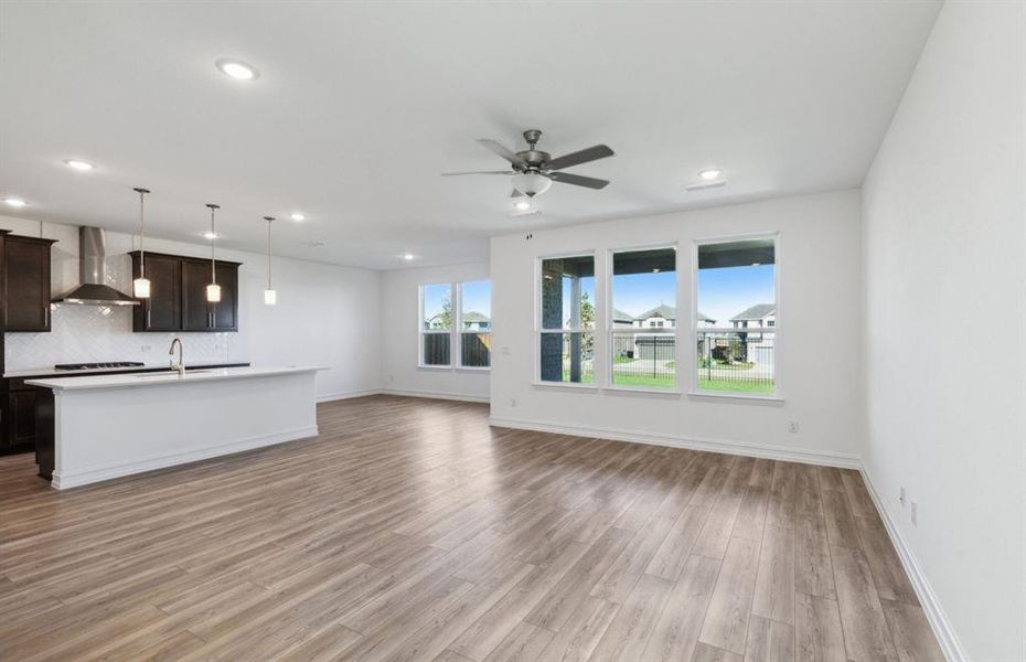 Bright gathering room with large windows *real home pictured