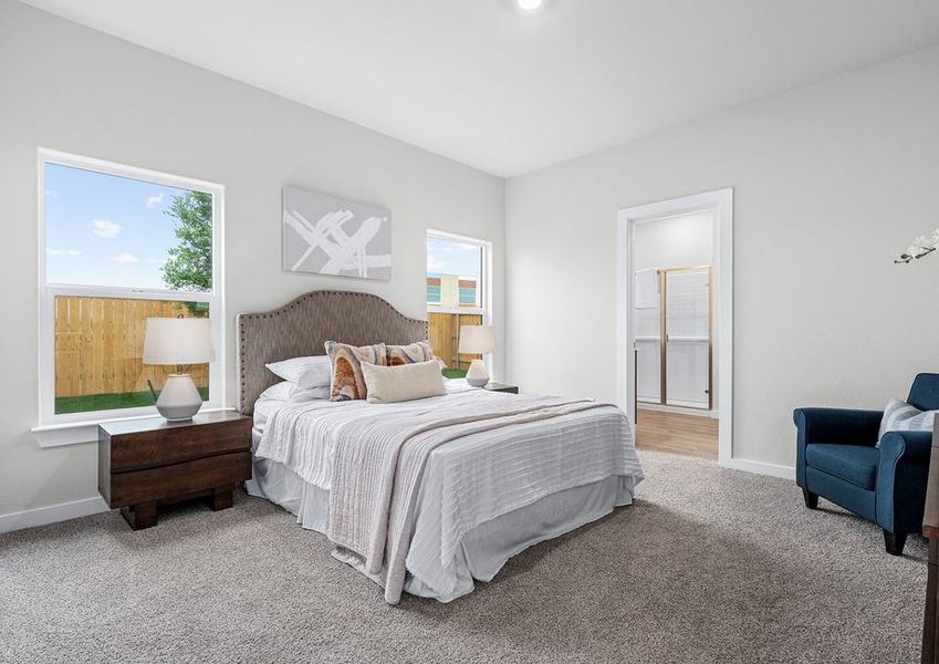 The master bedroom is spacious and has a large window. The master bedroom is spacious and has a large window.