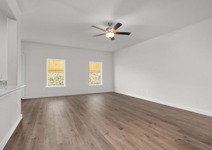 The family room has three large windows that let in great, natural light. The family room has three large windows that let in great, natural light.