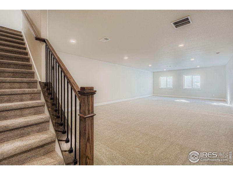 Spacious, unfurnished interior of a new home in RainDance National 60/70, Windsor (Image 18).