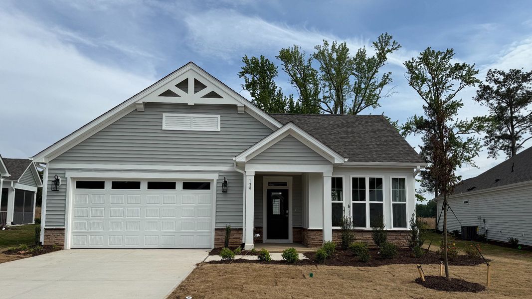 Front exterior of a new home in The Cottages at 78 North, Sanford, NC, highlighting curb appeal (Image 25). Front exterior of a new home in The Cottages at 78 North, Sanford, NC, highlighting curb appeal (Image 25).