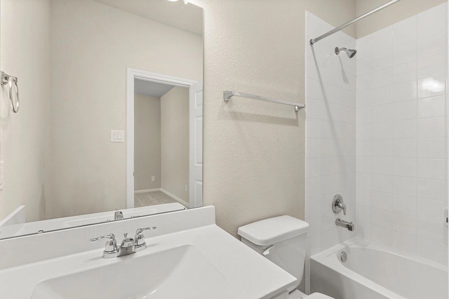 Furnished interior view inside a new home in Spring Creek Trails, Magnolia (Image 9).