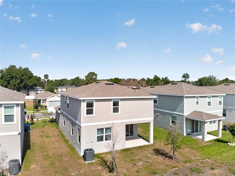 Exterior details and patio area of a home in Seasons at Forest Creek, Haines City (Image 3).