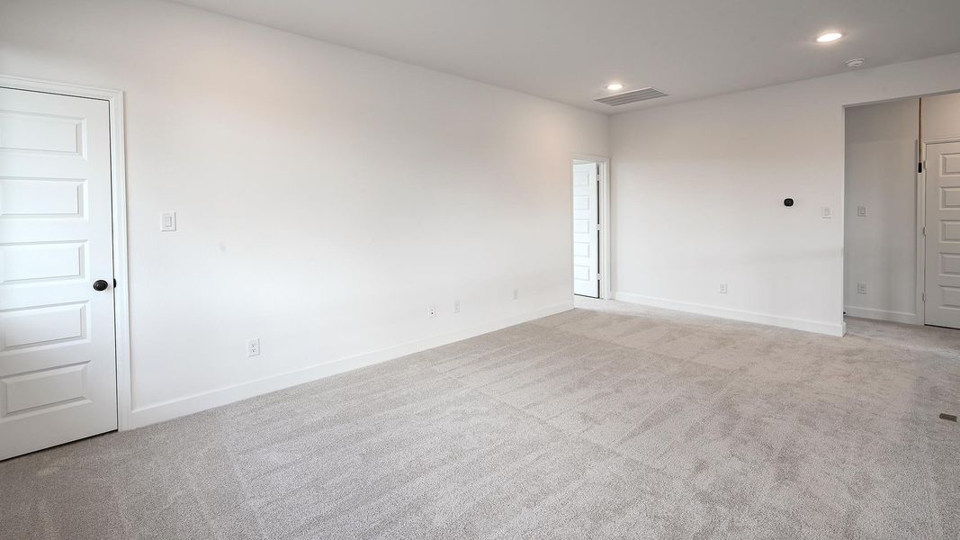 Spare room featuring carpet floors and recessed lighting