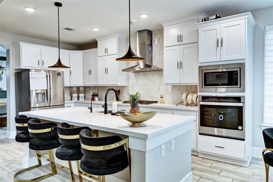 GOURMET KITCHEN WITH CUSTOM DESIGNED HIGH CHAIRS