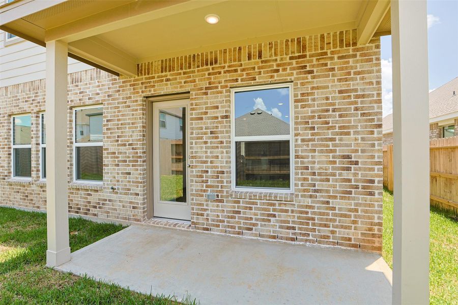 Exterior details and patio area of a home in Sunterra, Katy (Image 3).