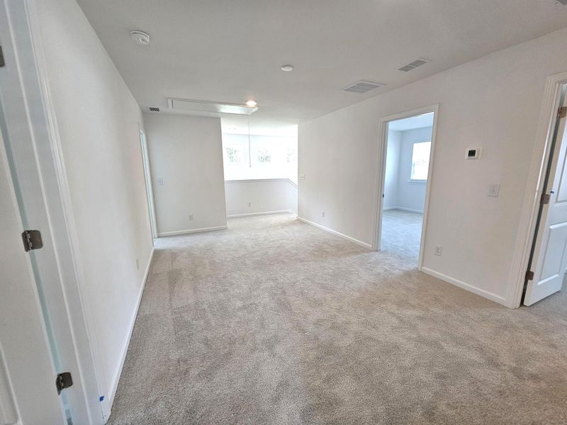 Spacious, unfurnished interior of a new home in Creekside at Andrews, Summerville (Image 19).