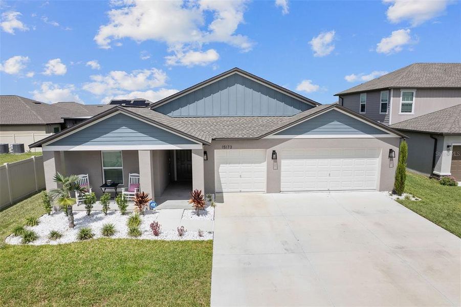 Front exterior of a new home in Balm Grove, Wimauma, FL, highlighting curb appeal (Image 23).