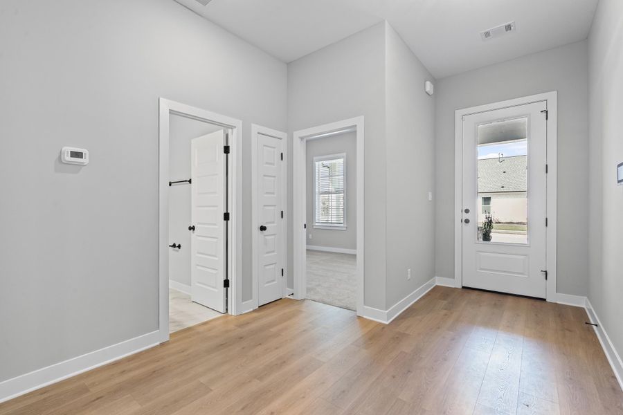 Foyer entrance featuring baseboards and light wood-style floors