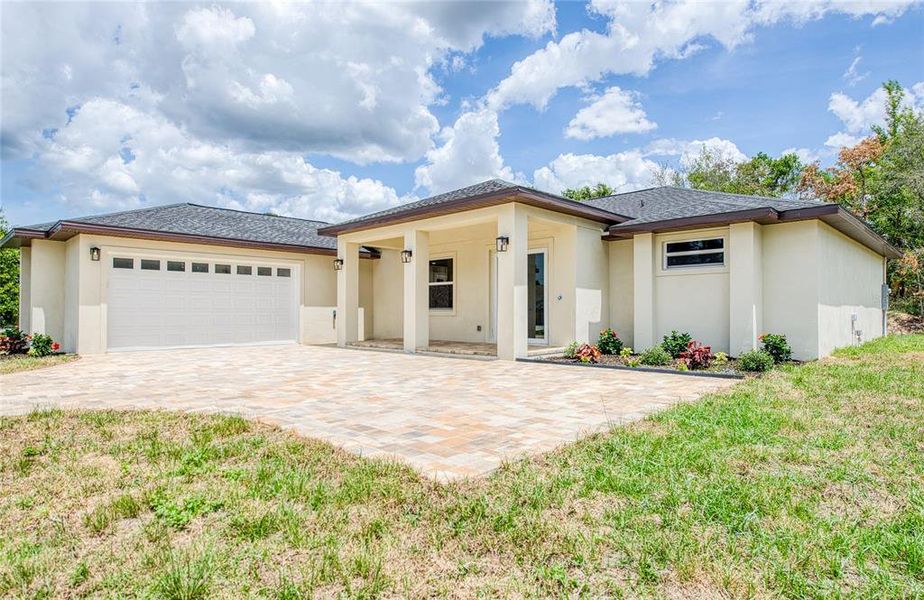 Front exterior of a new home in , Spring Hill, FL, highlighting curb appeal (Image 2). Front exterior of a new home in , Spring Hill, FL, highlighting curb appeal (Image 2).