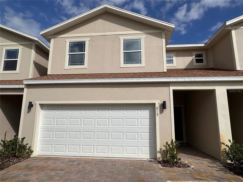 Front exterior of a new home in , Clermont, FL, highlighting curb appeal (Image 1). Front exterior of a new home in , Clermont, FL, highlighting curb appeal (Image 1).