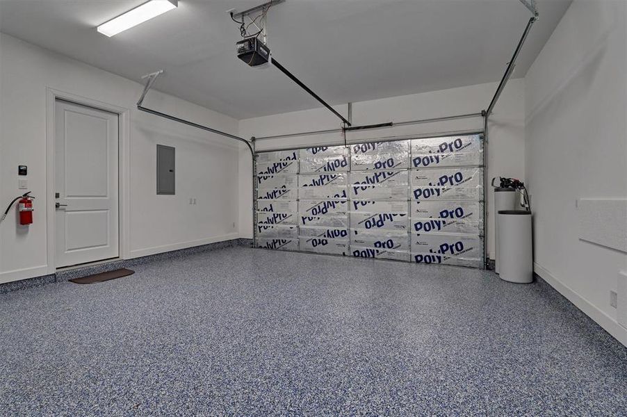 Insulated garage door with epoxy flooring and water softener!