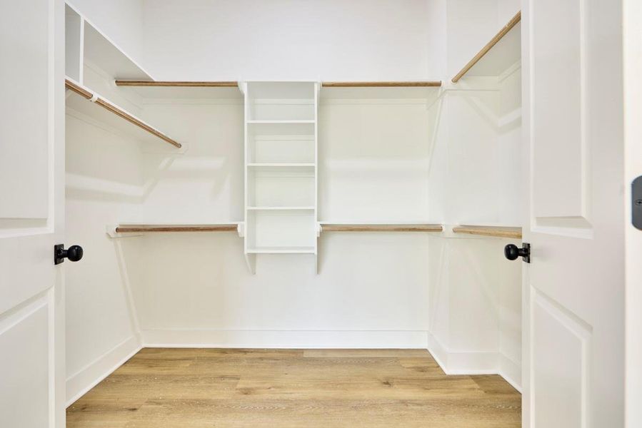 Never run out of space again with this impressive walk-in closet, offering ample storage and a well-organized layout. Featuring built-in shelving and plenty of room for all your clothes and accessories, it’s every fashion lover’s dream Never run out of space again with this impressive walk-in closet, offering ample storage and a well-organized layout. Featuring built-in shelving and plenty of room for all your clothes and accessories, it’s every fashion lover’s dream