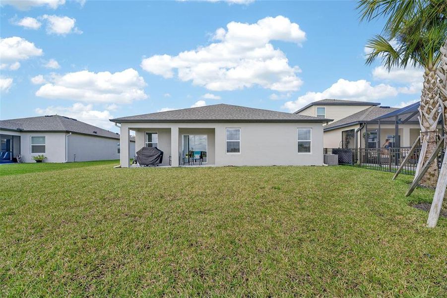 Exterior details and patio area of a home in Summerwoods, Parrish (Image 30).