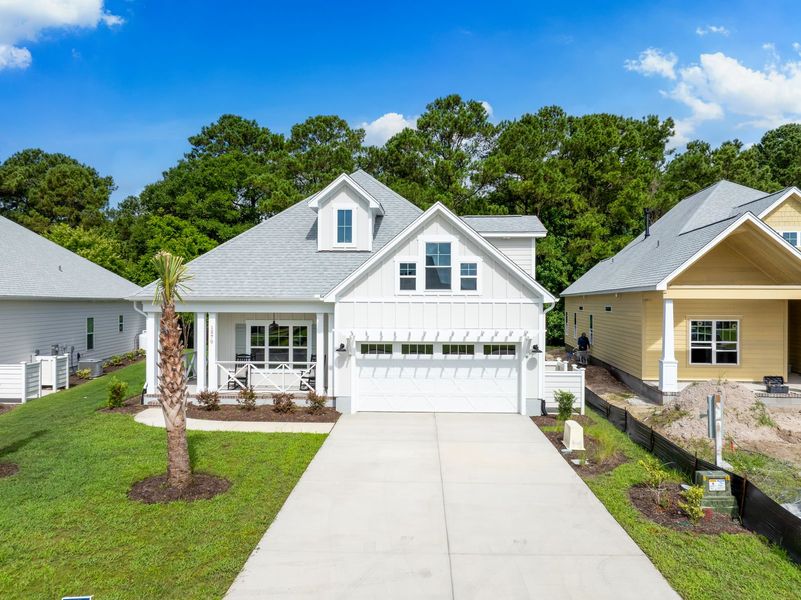 Front exterior of a new home in The Sanctuary at Sunset Beach, Sunset Beach, NC, highlighting curb appeal (Image 24).