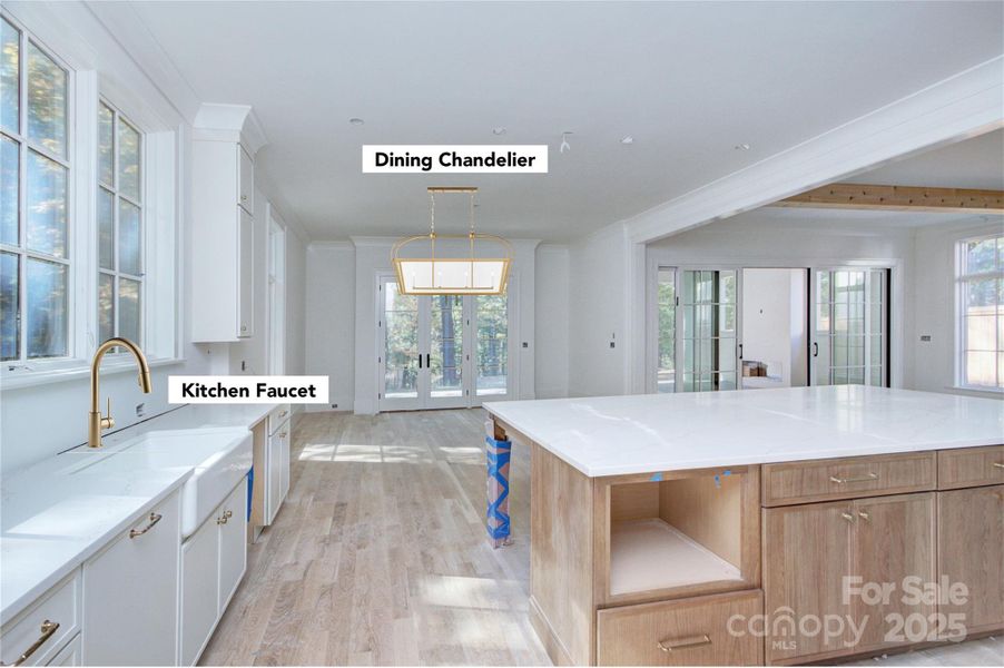 Kitchen with planned lighting and faucets depicted Kitchen with planned lighting and faucets depicted