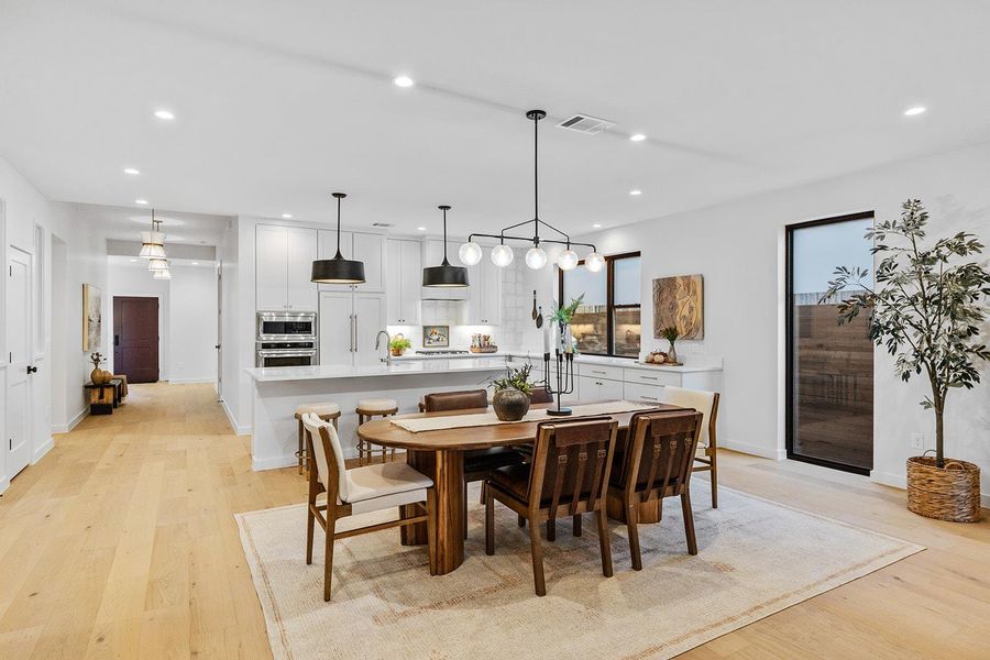 Dining space featuring light wood-style flooring and recessed lighting