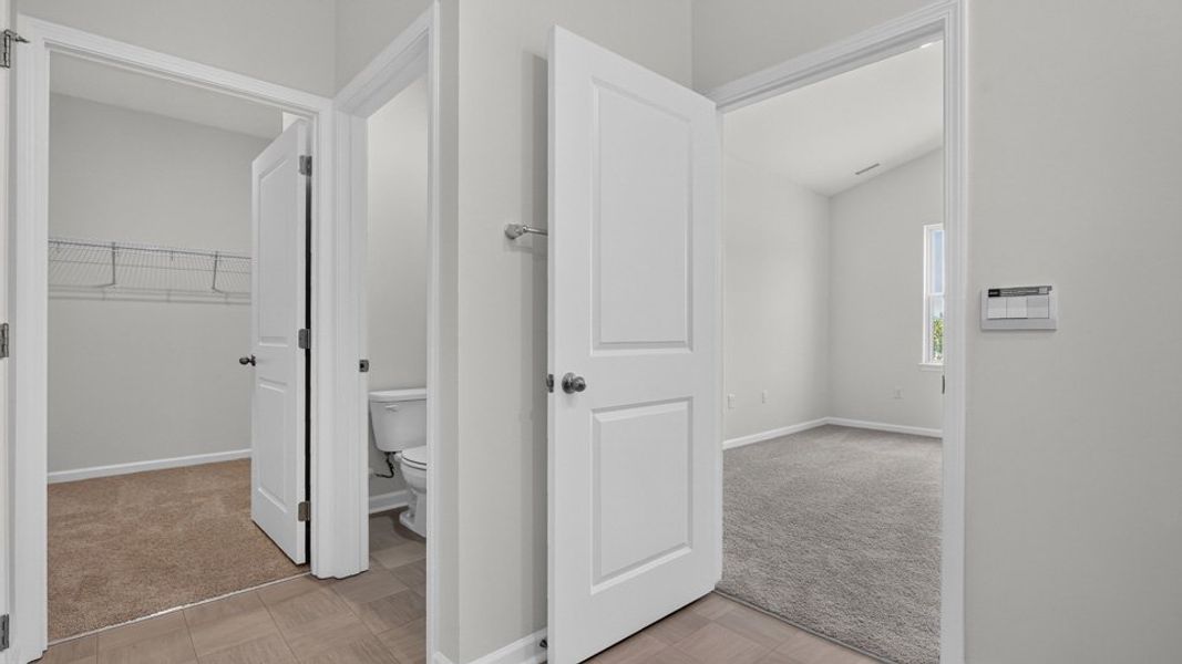 Spacious, unfurnished interior of a new home in The Grove at Matthews Landing, Fuquay Varina (Image 30).