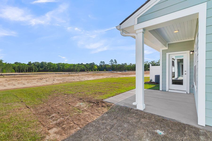 Exterior details and patio area of a home in , Ravenel (Image 17). Exterior details and patio area of a home in , Ravenel (Image 17).