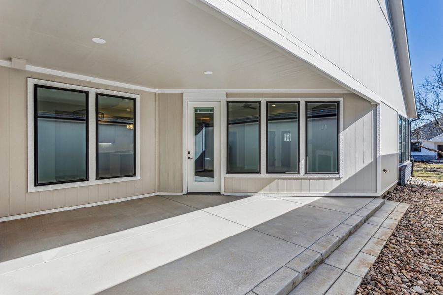Exterior details and patio area of a home in The Courtyards at Jacobs Farm, Wichita (Image 3).