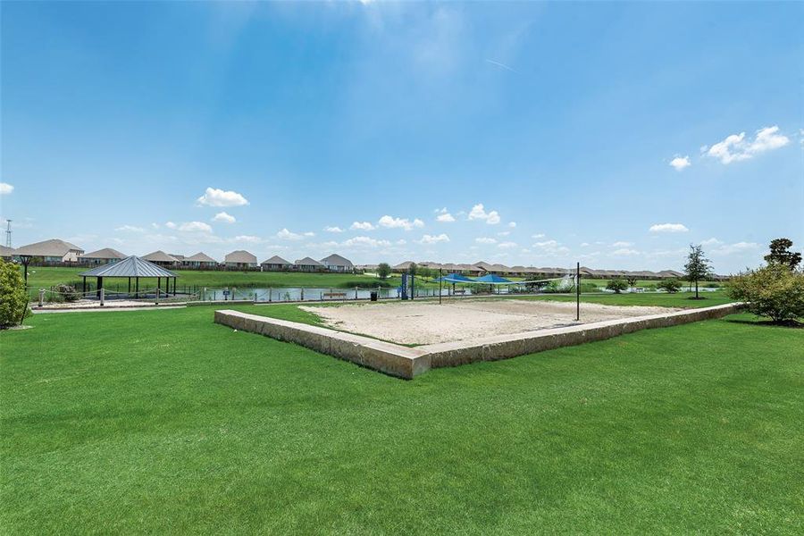 View of green lawn with a residential view, a gazebo, volleyball court, and a water view View of green lawn with a residential view, a gazebo, volleyball court, and a water view