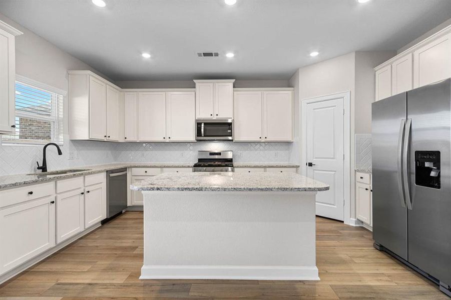 The kitchen have brand-new Whirlpool kitchen appliances and granite countertops.