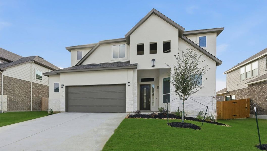 Front exterior of a new home in Buffalo Crossing, Cibolo, TX, highlighting curb appeal (Image 22).