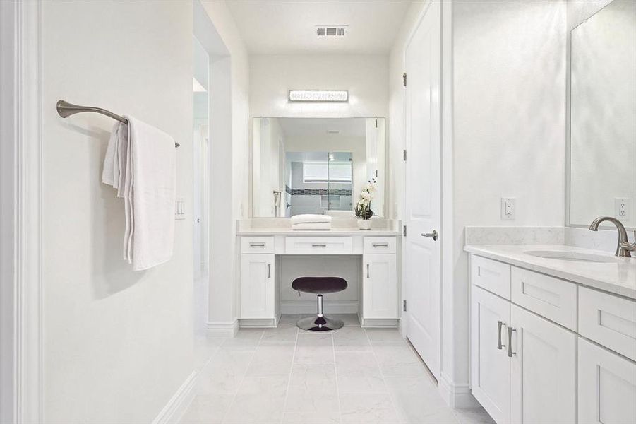 Bathroom featuring dual vanity and tile floors