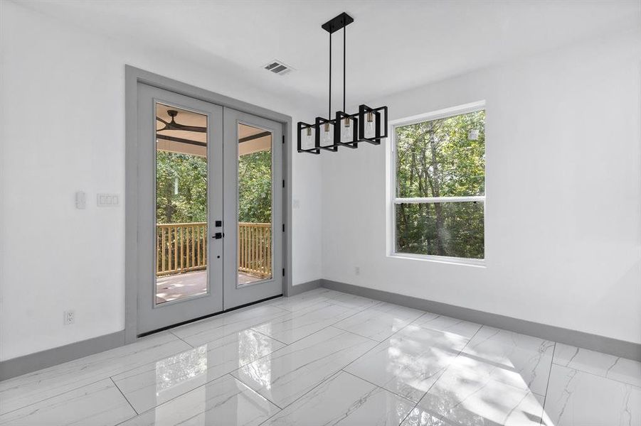 Dining area and French Doors leading to the covered back deck