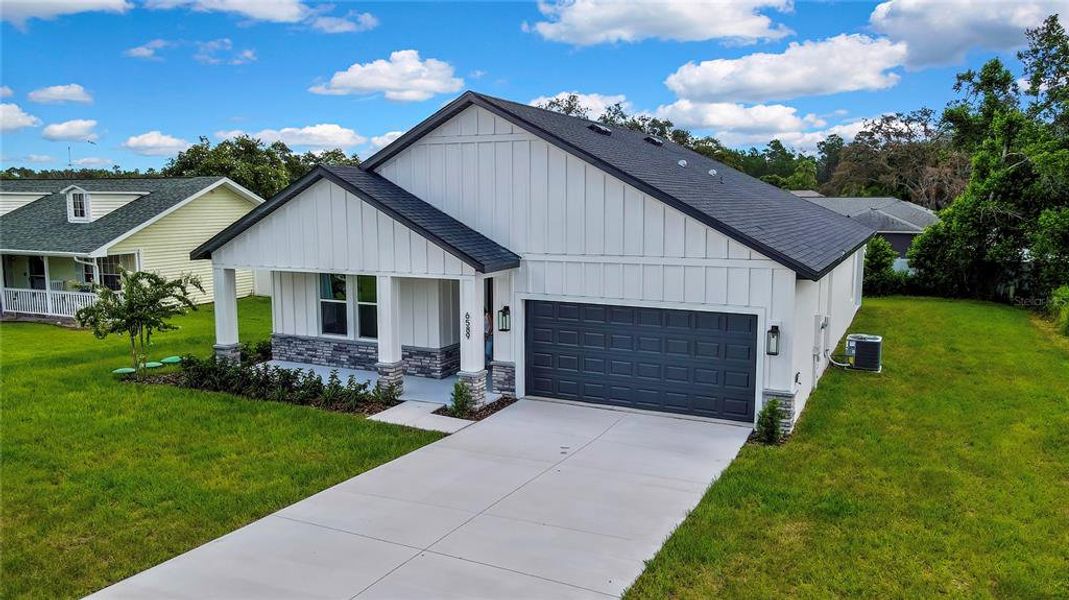 Front exterior of a new home in , Spring Hill, FL, highlighting curb appeal (Image 23). Front exterior of a new home in , Spring Hill, FL, highlighting curb appeal (Image 23).