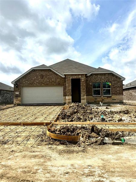 Brick exterior with stone accents and a two-car garage Brick exterior with stone accents and a two-car garage