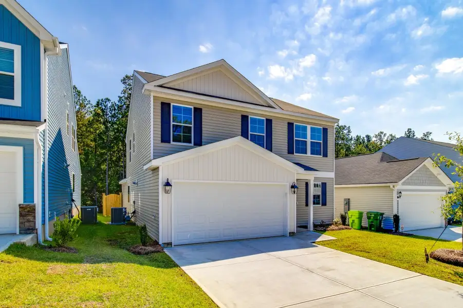 Front exterior of a new home in Killians Crossing, Blythewood, SC, highlighting curb appeal (Image 2). Front exterior of a new home in Killians Crossing, Blythewood, SC, highlighting curb appeal (Image 2).