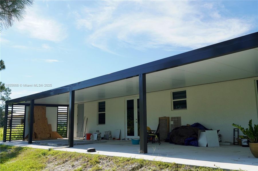 Front exterior of a new home in , Lehigh Acres, FL, highlighting curb appeal (Image 33).