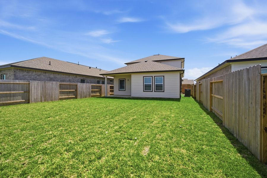 Exterior details and patio area of a home in Windrose Green, Angleton (Image 4).