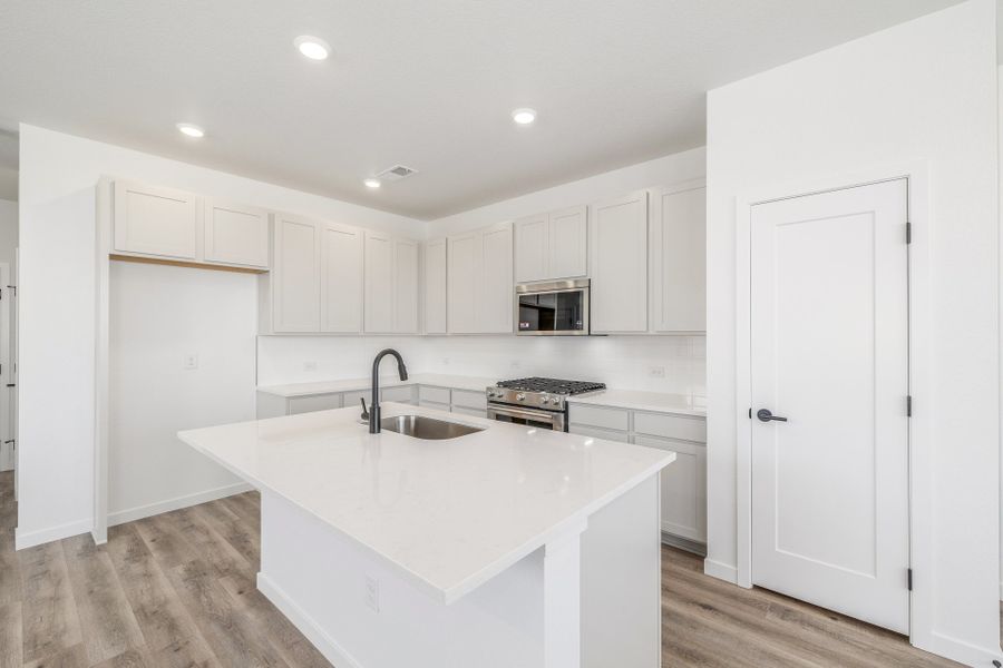 Furnished interior view inside a new home in Painted Prairie, Aurora (Image 6).