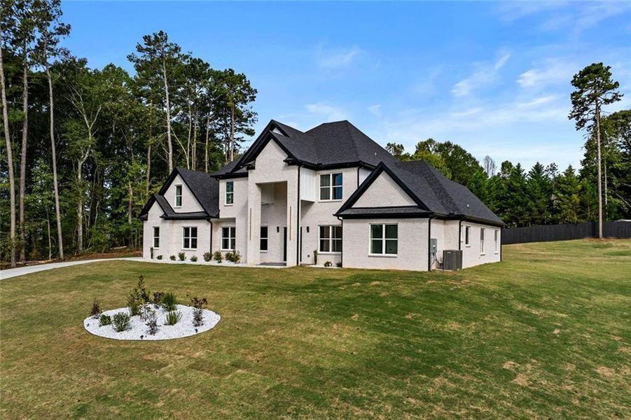Front exterior of a new home in , Loganville, GA, highlighting curb appeal (Image 25).