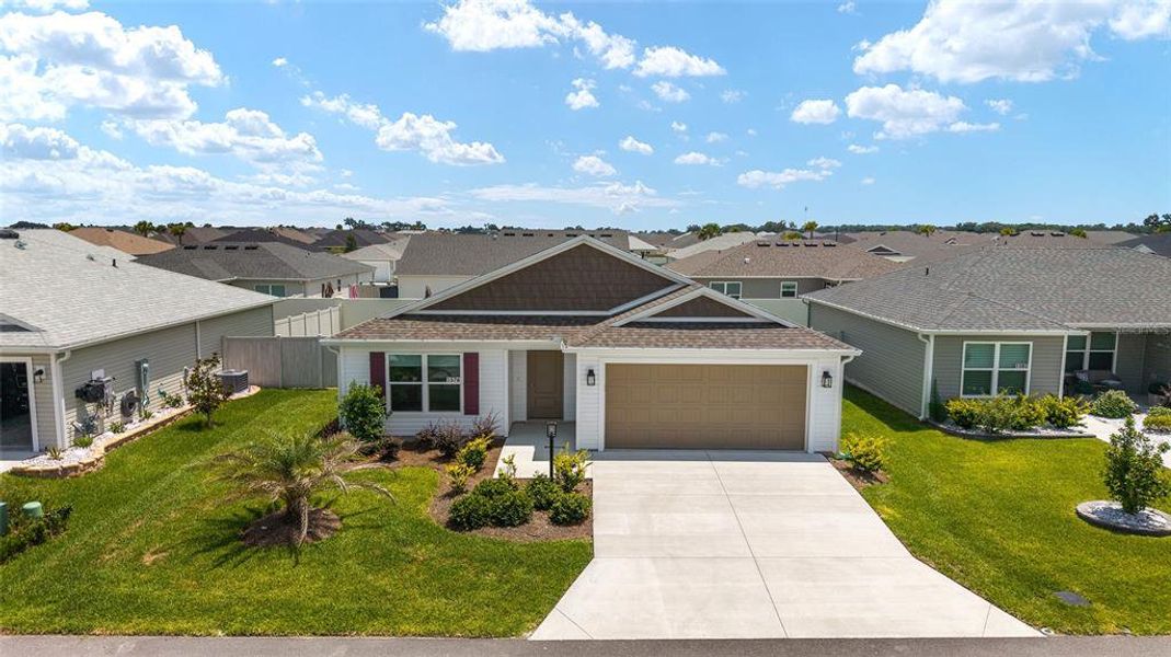Front exterior of a new home in , The Villages, FL, highlighting curb appeal (Image 22).