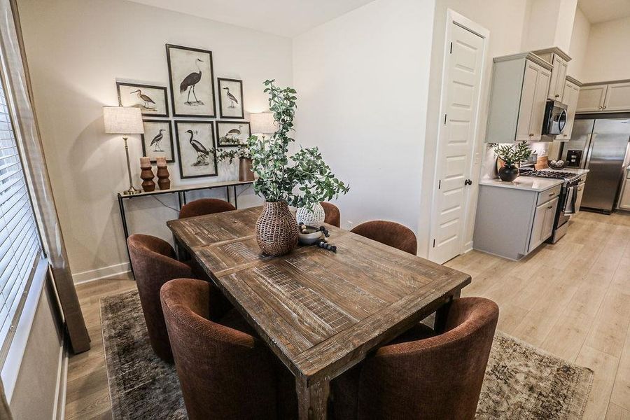 Dining space with light wood-type flooring