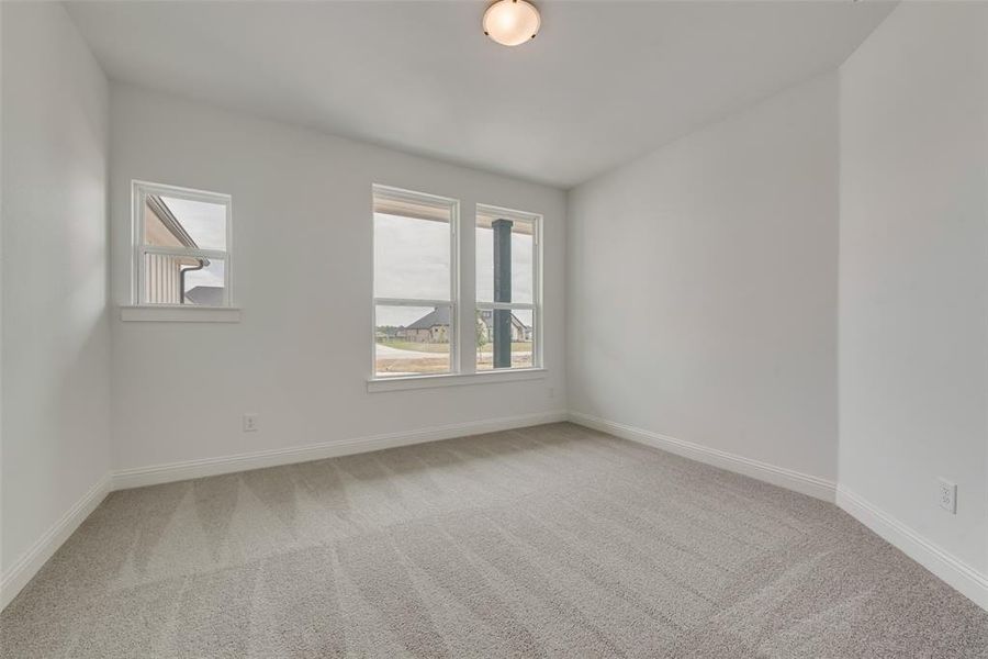 Empty room with carpet floors