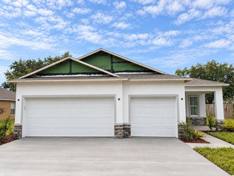 Front exterior of a new home in Palm Coast, Palm Coast, FL, highlighting curb appeal (Image 12).